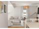 Bright and airy living room with neutral décor, hardwood floors, and stylish lighting at 814 Rutledge Ave, Charleston, SC 29403
