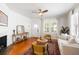Comfortable living room showcasing hardwood floors, a fireplace, and neutral decor at 814 Rutledge Ave, Charleston, SC 29403
