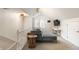 Upstairs living room with vaulted ceilings, modern sofa, and a bright window at 814 Rutledge Ave, Charleston, SC 29403