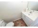 Powder room featuring white vanity and patterned floors at 8522 Long Meadow Dr, Charleston, SC 29420