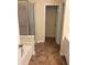 Bathroom featuring a glass shower, tub, and open doorway at 8522 Long Meadow Dr, Charleston, SC 29420