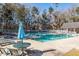 View of community pool with clear water and lounge chairs at 8522 Long Meadow Dr, Charleston, SC 29420