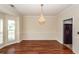 Dining room featuring a chandelier and hardwood floors at 8522 Long Meadow Dr, Charleston, SC 29420