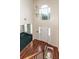 Grand two story foyer features beautiful hardwood flooring and a statement chandelier at 8522 Long Meadow Dr, Charleston, SC 29420
