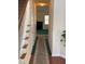 Hallway with carpet and view to living room with fireplace at 8522 Long Meadow Dr, Charleston, SC 29420