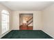 Living room featuring green carpet and view to dining room with hardwood floors at 8522 Long Meadow Dr, Charleston, SC 29420