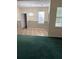 View of the living space with tiled floors and a decorative lighting fixture at 8522 Long Meadow Dr, Charleston, SC 29420