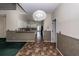 Open-concept living space with tiled floors, decorative lighting, and views to the kitchen at 8522 Long Meadow Dr, Charleston, SC 29420