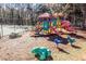 View of community playground with colorful play structure and swings at 8522 Long Meadow Dr, Charleston, SC 29420