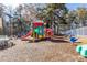 View of community playground with colorful play structure and swings at 8522 Long Meadow Dr, Charleston, SC 29420