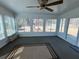 Bright sunroom with multiple windows overlooking the backyard at 8522 Long Meadow Dr, Charleston, SC 29420