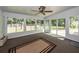 Inviting sunroom with ceiling fan, neutral color palette, and outdoor access at 8522 Long Meadow Dr, Charleston, SC 29420