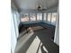 Bright sunroom with multiple windows and backyard access at 8522 Long Meadow Dr, Charleston, SC 29420