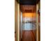 The bar area features wood cabinets and is stocked with assorted beverages at 905 Palm Blvd, Isle of Palms, SC 29451