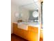 Bright bathroom features a modern sink and tiled backsplash with a seamless large mirror at 905 Palm Blvd, Isle of Palms, SC 29451