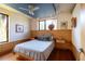 Cozy bedroom with hardwood floors, a fan, and natural lighting streaming through the windows at 905 Palm Blvd, Isle of Palms, SC 29451