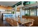 Spacious dining room with wood table and chairs with a view of the outdoor landscape at 905 Palm Blvd, Isle of Palms, SC 29451