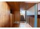Hallway with wood paneled walls and ceilings, offering a warm and inviting ambiance at 905 Palm Blvd, Isle of Palms, SC 29451