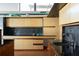 This kitchen features light wood cabinets, dark countertops, and sleek fixtures at 905 Palm Blvd, Isle of Palms, SC 29451