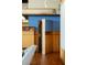 The living room showcases wood paneling and custom blue shelving units and cabinetry at 905 Palm Blvd, Isle of Palms, SC 29451