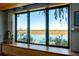 A picture window with scenic waterfront views, custom cabinetry, and natural light create a serene living space at 905 Palm Blvd, Isle of Palms, SC 29451