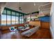 Bright living room with water views, designer furniture, hardwood floors, and an open layout at 905 Palm Blvd, Isle of Palms, SC 29451