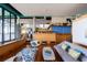Spacious living room showcasing modern design, hardwood floors, and large windows at 905 Palm Blvd, Isle of Palms, SC 29451