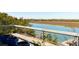 Relax on this balcony overlooking a tranquil river view, complete with potted plants at 905 Palm Blvd, Isle of Palms, SC 29451