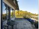 Enjoy outdoor living on this covered patio, overlooking lush greenery with a place to sit at 905 Palm Blvd, Isle of Palms, SC 29451
