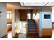 Modern staircase with wood and light blue tile accents leading to a skylight-lit upper level at 905 Palm Blvd, Isle of Palms, SC 29451