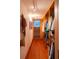 Organized walk-in closet featuring custom shelving, hardwood floors, and bright lighting at 905 Palm Blvd, Isle of Palms, SC 29451