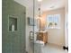 Modern bathroom featuring sleek glass shower, geometric tiles, and wooden vanity at 95 Gordon St, Charleston, SC 29403