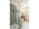 Elegant bathroom featuring a glass shower, geometric tiles, and wooden vanity at 95 Gordon St, Charleston, SC 29403