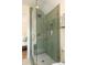 Chic shower with olive-green hexagon tiles, glass door and bronze hardware at 95 Gordon St, Charleston, SC 29403