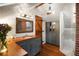 Bathroom featuring a dark gray vanity with wood countertop, a rustic barn door, and a glass shower with tile walls at 95 Gordon St, Charleston, SC 29403