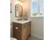 Charming bathroom features a patterned-tile floor, modern vanity, stylish fixtures, and a bright window at 95 Gordon St, Charleston, SC 29403