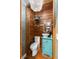Charming powder room with wood paneling, decorative lighting, and vessel sink at 95 Gordon St, Charleston, SC 29403