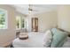 Bright bedroom with three large windows, and adjacent ensuite bathroom at 95 Gordon St, Charleston, SC 29403