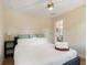 Comfortable bedroom with a ceiling fan, natural light, and adjacent ensuite bathroom at 95 Gordon St, Charleston, SC 29403