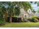 Attractive brick home with dormer windows, lush landscaping, and a well-manicured lawn at 95 Gordon St, Charleston, SC 29403