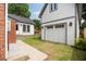 Exterior view featuring a garage, steps, and walkway surrounded by a well maintained lawn at 95 Gordon St, Charleston, SC 29403