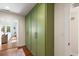 Hallway boasts hardwood floors, green cabinets, and access to other rooms of the house at 95 Gordon St, Charleston, SC 29403