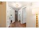 Hallway features hardwood floors, stylish lighting, and neutral walls with white trim at 95 Gordon St, Charleston, SC 29403
