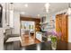 Bright kitchen features modern appliances, farmhouse sink, and a unique sliding barn door detail at 95 Gordon St, Charleston, SC 29403