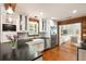 Bright kitchen with stainless appliances, stone countertops, farmhouse sink, and hardwood floors at 95 Gordon St, Charleston, SC 29403
