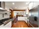 Gourmet kitchen featuring stainless steel appliances, a kitchen island, and hardwood flooring at 95 Gordon St, Charleston, SC 29403