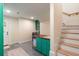 Bright laundry room with green cabinetry, wood countertop, and modern washer and dryer at 95 Gordon St, Charleston, SC 29403