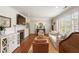 Well-lit living room showcasing a fireplace, hardwood floors, and an open layout at 95 Gordon St, Charleston, SC 29403