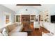 Inviting living room features a vaulted ceiling, brick accent wall, and charming built-in shelving at 95 Gordon St, Charleston, SC 29403