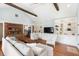 Inviting living room featuring built-in shelving, exposed beams, and hardwood floors at 95 Gordon St, Charleston, SC 29403